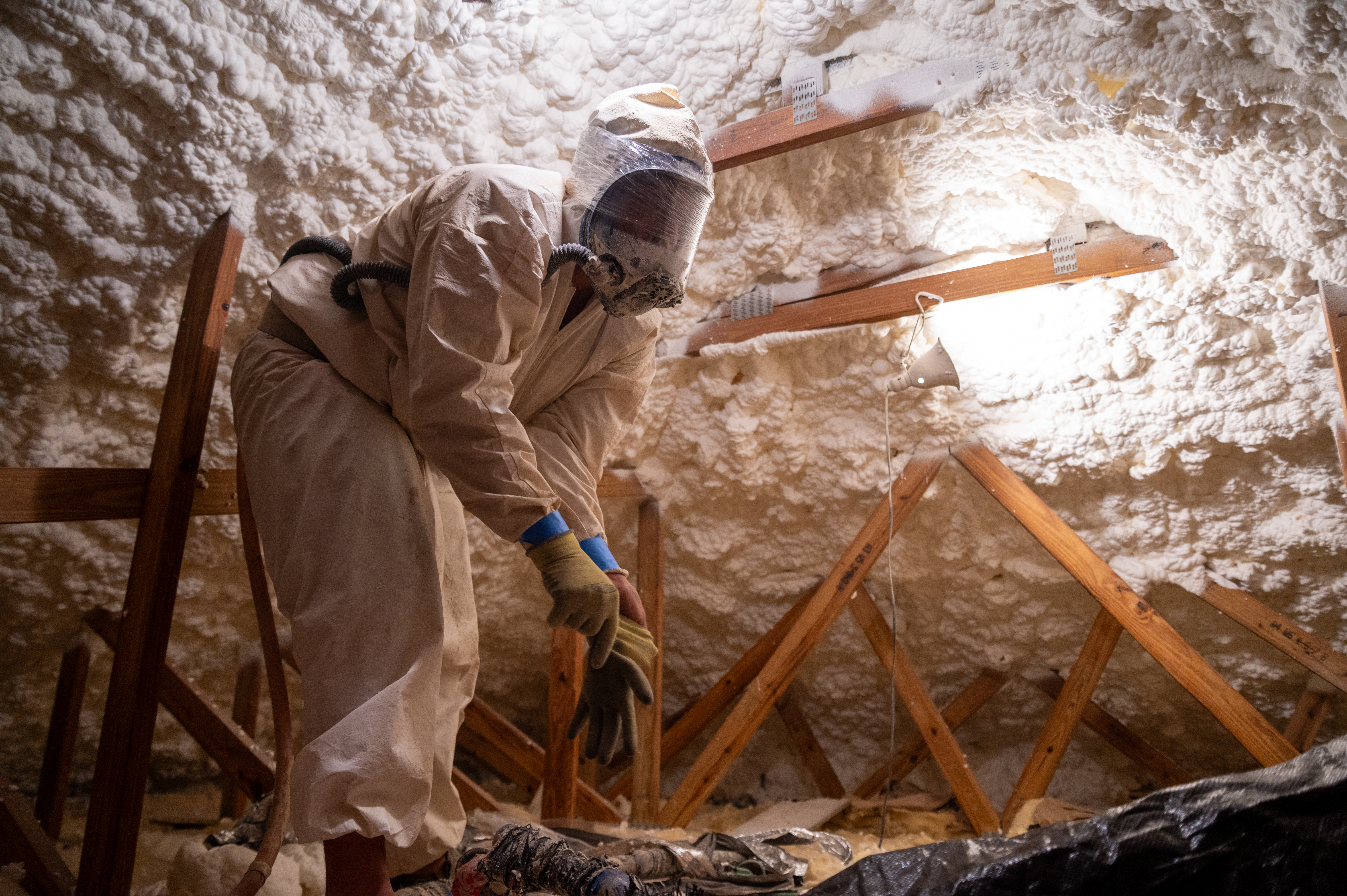 Image of Foam installation inside a building in the Cayman Islands as part of making it more energy effiecent for residents of the National Housing Development Trust (NHDT)